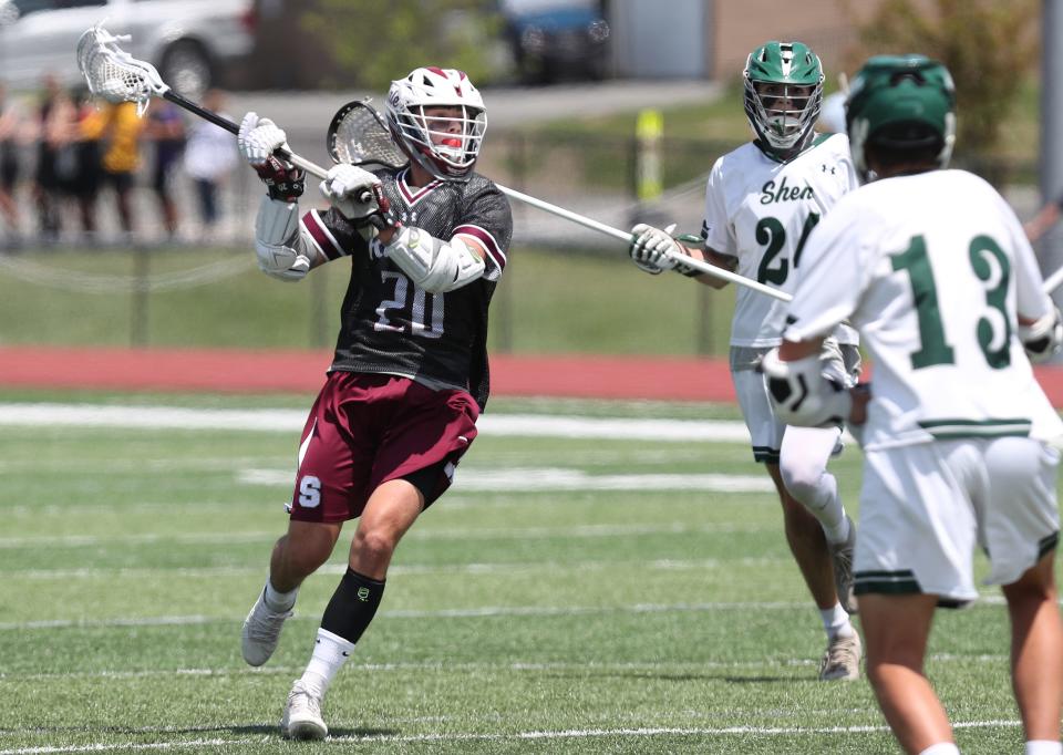 Scarsdale's Ryan Ornstein (20) fires a shot for a first half gaol against Shenendehowa during the boys lacrosse Class A regional final at Shaker High School in Albany June 4, 2022.  Scarsdale won the game 14-6.