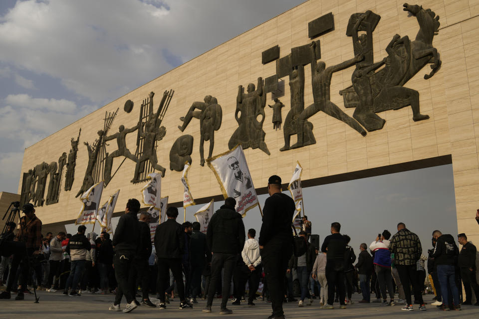 Protesters gather in Tahrir Square in Baghdad, Iraq, Friday, Feb. 3, 2023. As the Iraqi currency continued its slide, some 150 protesters gathered Friday in central Baghdad, call on the government to take action to stop the crisis. (AP Photo/Hadi Mizban)