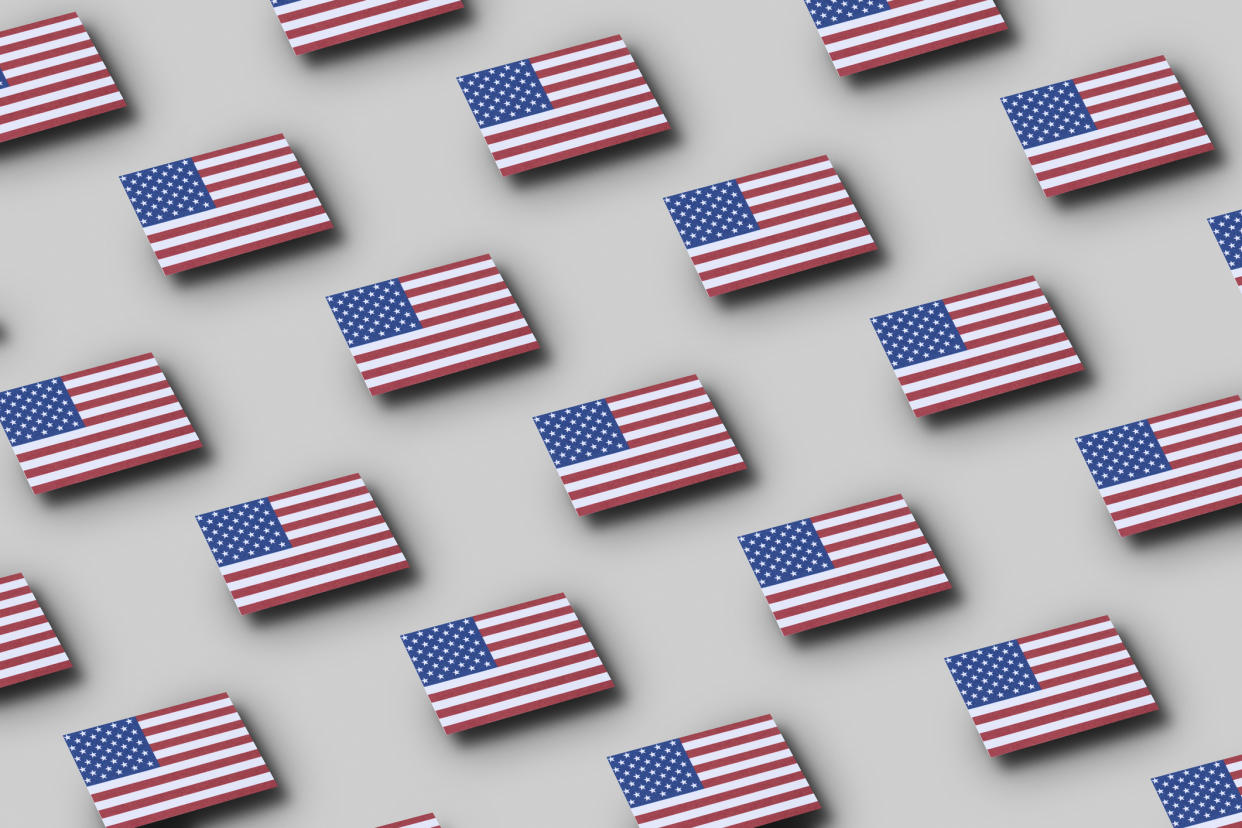  Grid pattern of American flags floating. 