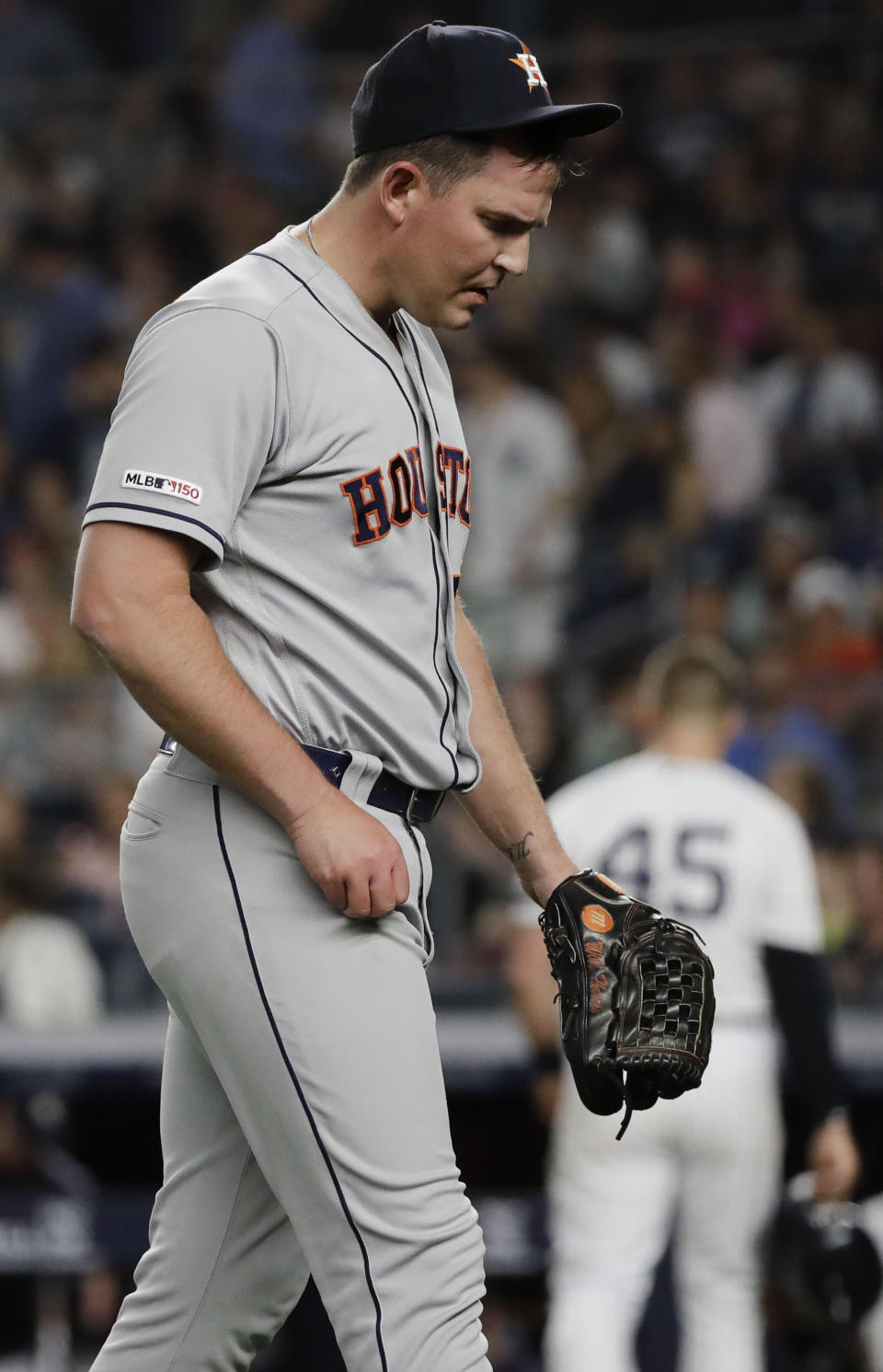 Houston Astros relief pitcher Will Harris leaves the field after the sixth inning of the team's baseball game against the New York Yankees on Saturday, June 22, 2019, in New York. (AP Photo/Frank Franklin II)