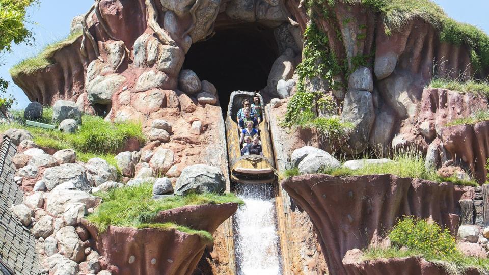 Disneyland visitors ride the Splash Mountain log flume
