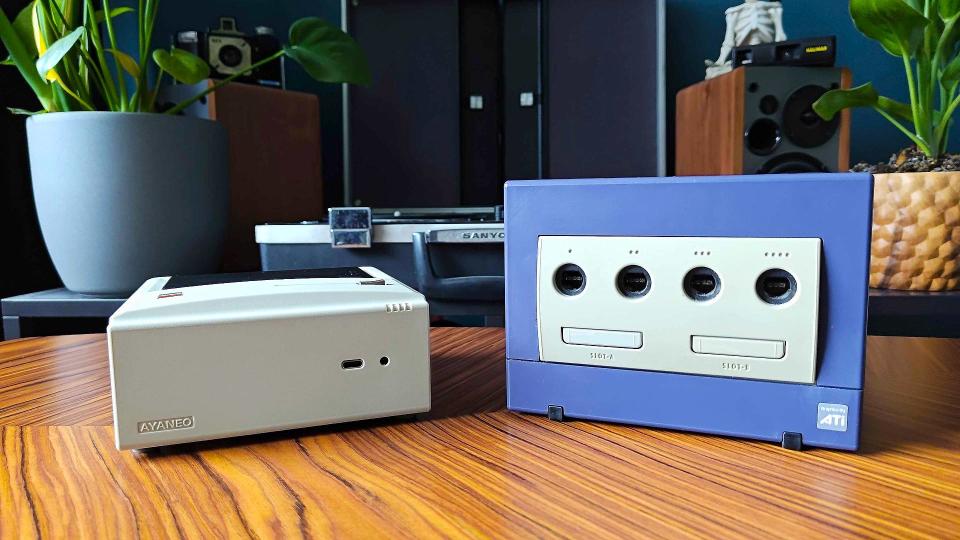 Ayaneo Mini PC AM01 next to purple Gamecube