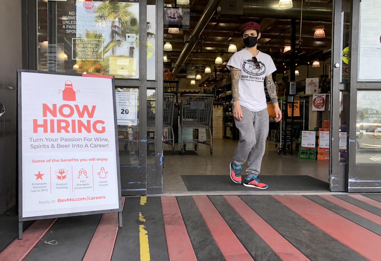 LARKSPUR, CALIFORNIA - APRIL 02: A customer walks by a now hiring sign at a BevMo store on April 02, 2021 in Larkspur, California. According to a report by the Bureau of Labor Statistics, the U.S. economy added 916,000 jobs in March and the unemployment rate dropped to 6 percent. Leisure and hospitality jobs led the way with 280,000 new jobs followed by restaurants with 176,000 jobs and construction with 110,000 new positions. (Photo by Justin Sullivan/Getty Images)