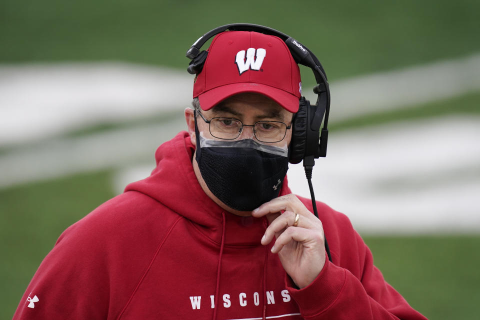 Wisconsin head coach Paul Chryst stands on the sideline during the first half of an NCAA college football game against Iowa, Saturday, Dec. 12, 2020, in Iowa City, Iowa. (AP Photo/Charlie Neibergall)