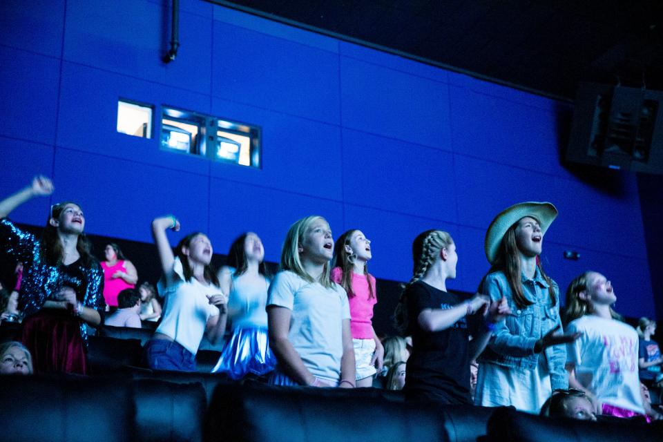 Taylor Swift Fans dance and sing along as they watch “Taylor Swift: The Eras Tour” at Malco Paradiso Cinema Grill and IMAX in Memphis, Tenn., on Saturday, October 14, 2023.