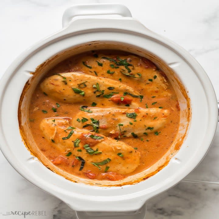 Chicken breasts in a creamy tomato sauce in a slow cooker