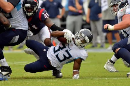 Sep 16, 2018; Nashville, TN, USA; Tennessee Titans running back Dion Lewis (33) dives for yardage against the Houston Texans during the second half at Nissan Stadium. Tennessee won 20-17. Mandatory Credit: Jim Brown-USA TODAY Sports