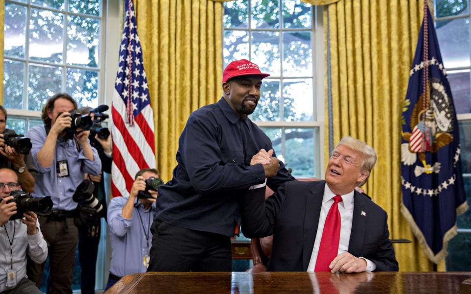 Rapper Kanye West, left, shakes hands with U.S. President Donald Trump  - Andrew Harrer /Bloomberg