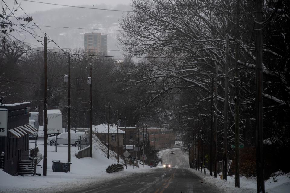 Few motorists travelled on Haywood Road in West Asheville during a January 2022 snowstorm.