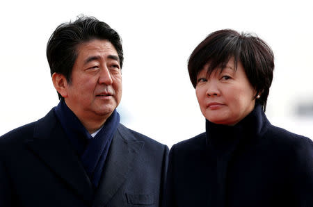 FILE PHOTO: Japan's Prime Minister Shinzo Abe and his wife Akie are pictured at Tokyo's Haneda Airport, Japan January 26, 2016. REUTERS/Toru Hanai