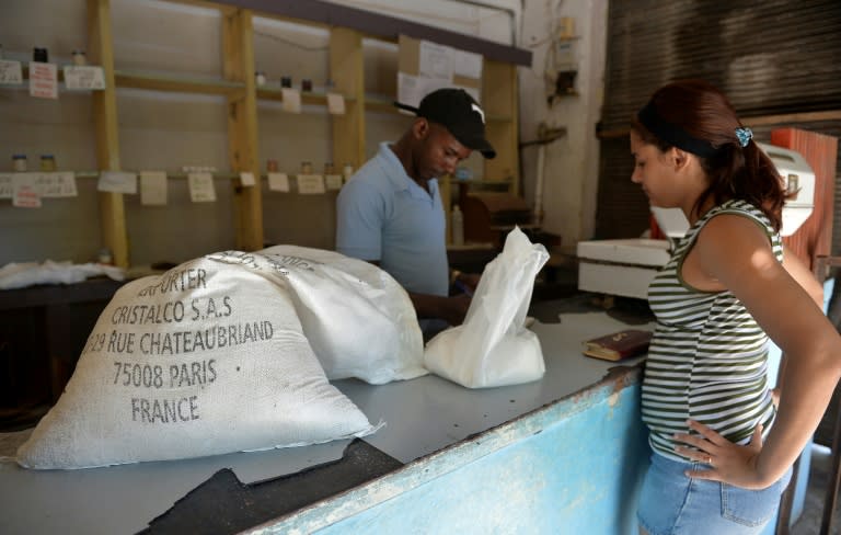 A woman buys sugar produced in France at a grocery store in the Cuban capital Havana -- experts are hoping the sector can rebound on the island, possibly with some foreign investment