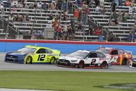 Ryan Blaney (12), Brad Keselowski (2) and Ross Chastain (42) head down the front stretch during the NASCAR Cup Series All-Star auto race at Texas Motor Speedway in Fort Worth, Texas, Sunday, June 13, 2021. (AP Photo/Larry Papke)