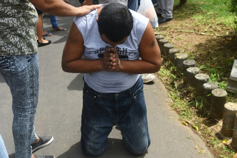 A Nicaraguan man, praying after his release from jail in Managua, was one of 26 protesters freed