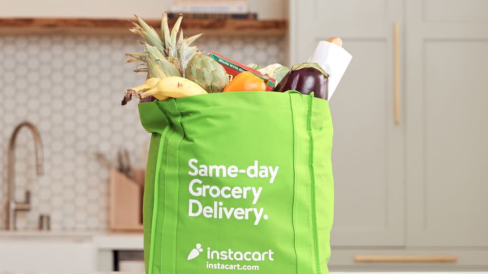 instacart delivery bag full of groceries in kitchen