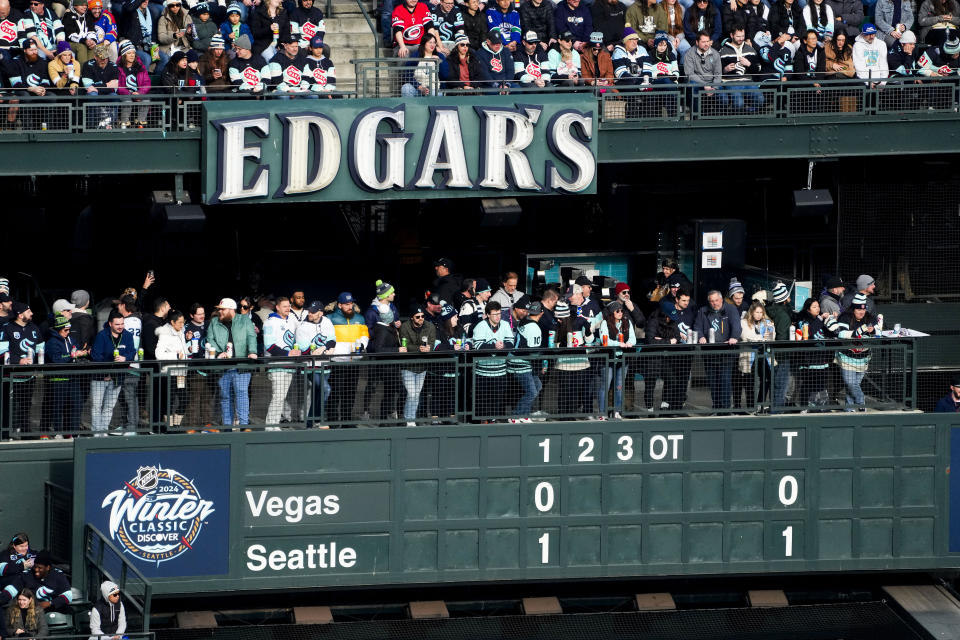 The outfield scoreboard shows a goal by the Seattle Kraken against the Vegas Golden Knights during the first period of the NHL Winter Classic hockey game, Monday, Jan. 1, 2024, in Seattle. (AP Photo/Lindsey Wasson)