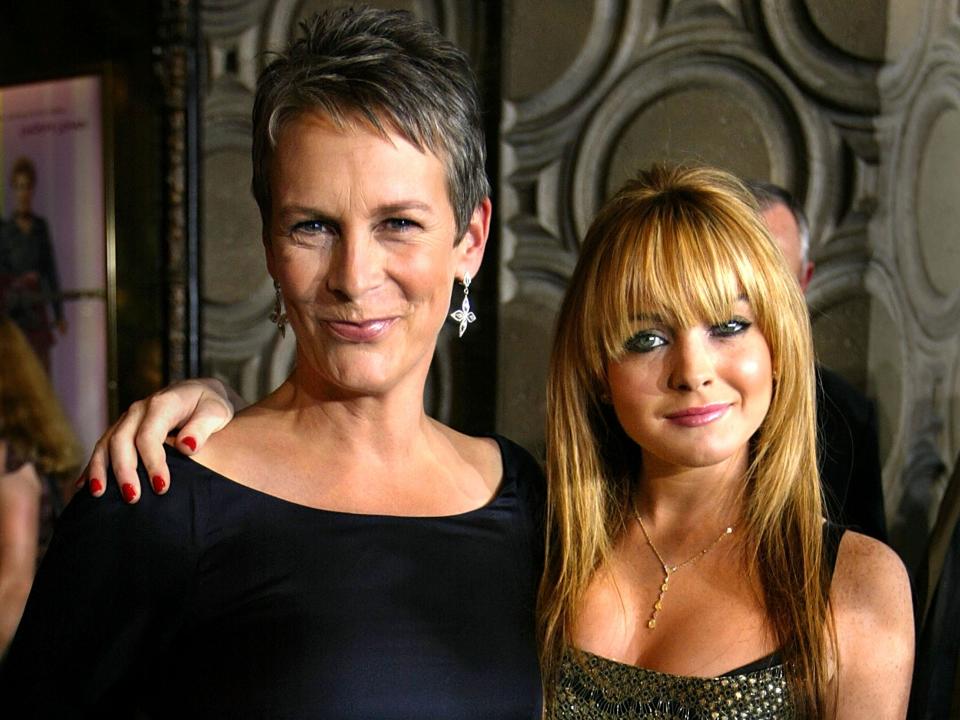 Linday Lohan with arm around Jamie Lee Curtis