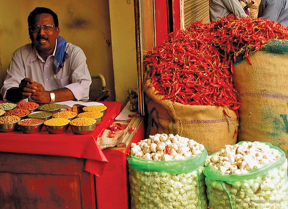 <p><b>One of the many streetside traders of Kerala.</b><br>©Donald Fels / Published in ‘Mosques of Cochin’ by Patricia Tusa Fels<br> The spice trade, assisted by the trade winds, carried Islam to south India and Southeast Asia. Many of the original Muslims of Kerala came from Gujarat, Yemen and Baghdad. Traders survived and flourished because of their ability to adapt, often accommodating their religious practices with local traditions.</p>