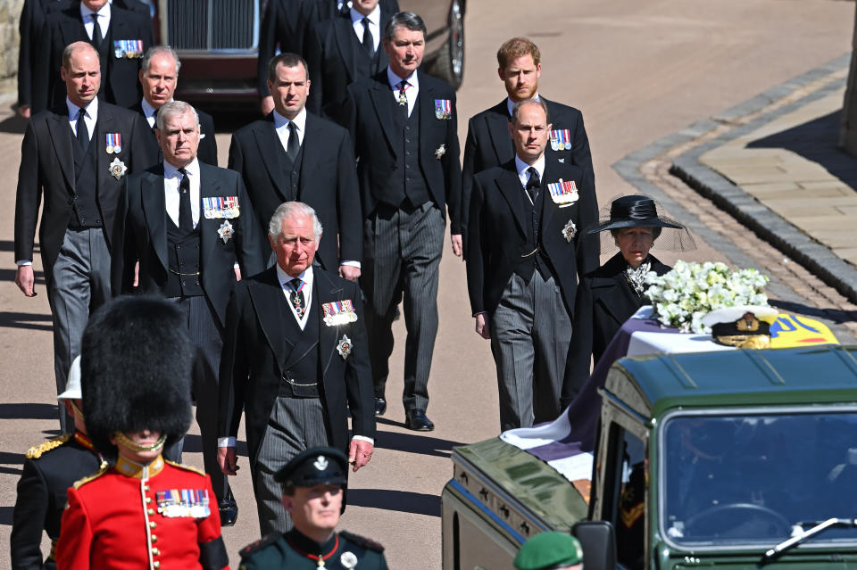 WINDSOR, UNITED KINGDOM - APRIL 17: (EMBARGOED FOR PUBLICATION IN UK NEWSPAPERS UNTIL 24 HOURS AFTER CREATE DATE AND TIME) Prince Charles, Prince of Wales, Princess Anne, Princess Royal, Prince Andrew, Duke of York, Prince Edward, Earl of Wessex, Prince William, Duke of Cambridge, Peter Phillips, Prince Harry, Duke of Sussex, David Armstrong-Jones, 2nd Earl of Snowdon and Vice Admiral Sir Timothy Laurence follow Prince Philip, Duke of Edinburgh's coffin (draped in his Royal Standard Flag and bearing his Royal Navy cap, sword and a bouquet of lilies, white roses, freesia and sweet peas) as it is carried on a specially designed Land Rover Defender hearse during his funeral procession to St. George's Chapel, Windsor Castle on April 17, 2021 in Windsor, England. Prince Philip of Greece and Denmark was born 10 June 1921, in Greece. He served in the British Royal Navy and fought in WWII. He married the then Princess Elizabeth on 20 November 1947 and was created Duke of Edinburgh, Earl of Merioneth, and Baron Greenwich by King VI. He served as Prince Consort to Queen Elizabeth II until his death on April 9 2021, months short of his 100th birthday. His funeral takes place today at Windsor Castle with only 30 guests invited due to Coronavirus pandemic restrictions. (Photo by Pool/Max Mumby/Getty Images)