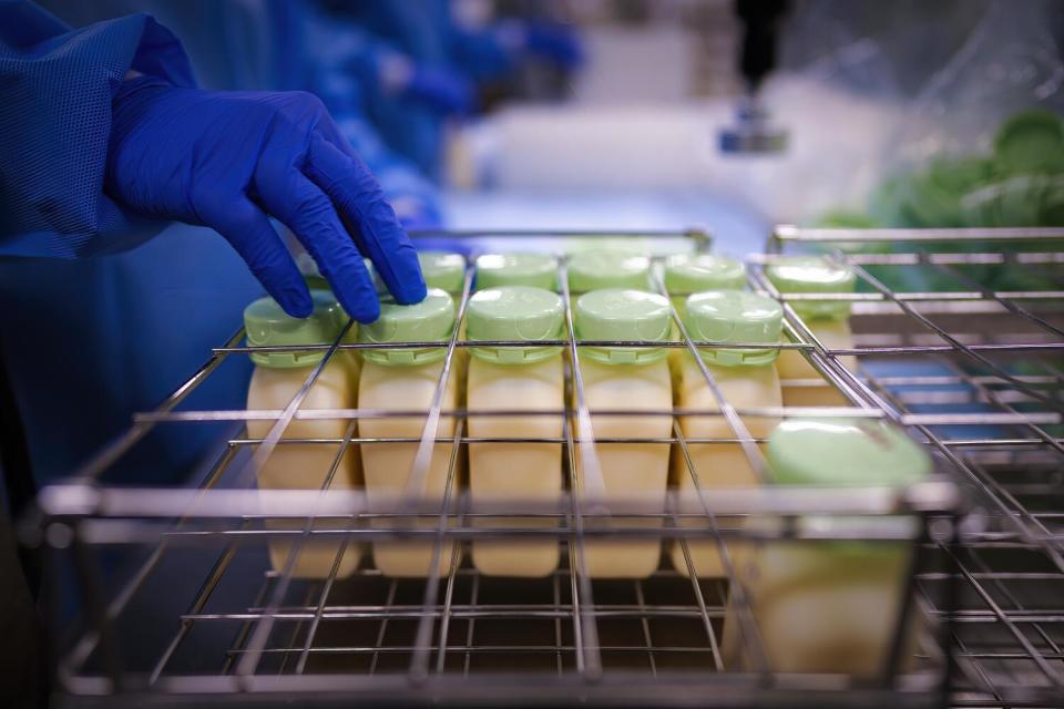 Bottles of breast milk are prepared for pasteurization at the UC Health Milk Bank.