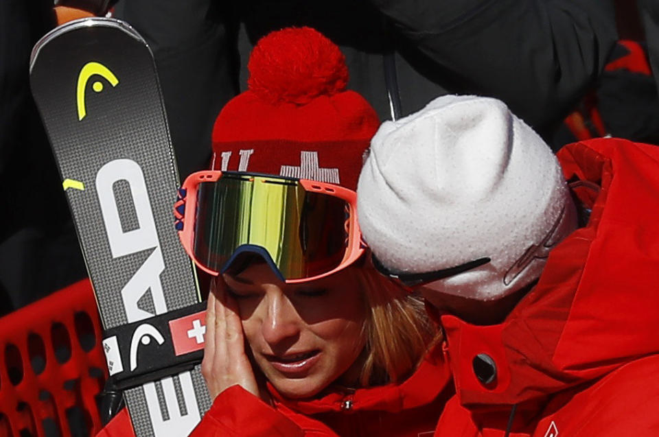 Alpine skier Lara Gut is comforted by&nbsp;her father, Pauli, after the women's&nbsp;super-G event.