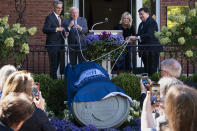 Artist Chas Fagan, left, John Rogers, chair of the White House Historical Association (WHAA) Board of Directors, first lady Jill Biden, and Stuart McLaurin, President of the WHHA, unveil a medallion sculpture honoring former first lady Jacqueline Kennedy at the Decatur House, Friday, Sept. 23, 2022, near the White House in Washington. (AP Photo/Jacquelyn Martin)