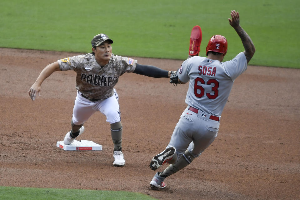 San Diego Padres second baseman Ha-Seong Kim (7) tags St. Louis Cardinals shortstop Edmundo Sosa (63) out as he goes into second base during the second inning of a baseball game Sunday, May 16, 2021, in San Diego. (AP Photo/Denis Poroy)