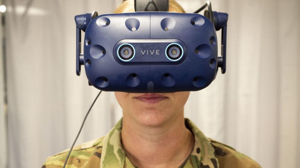 Staff Sgt. Renee Scherf, Detachment 23 curriculum engineer and MC-130H subject matter expert, dons virtual reality goggles. Members of the detachment, part of Air Education and Training Command, are reengineering tech training. (Staff Sgt. Keith James/Air Force)