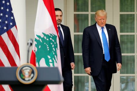 U.S. President Donald Trump and Lebanese Prime Minister Saad al-Hariri attend a joint press conference in the Rose Garden of the White House in Washington, U.S., July 25, 2017. REUTERS/Carlos Barria