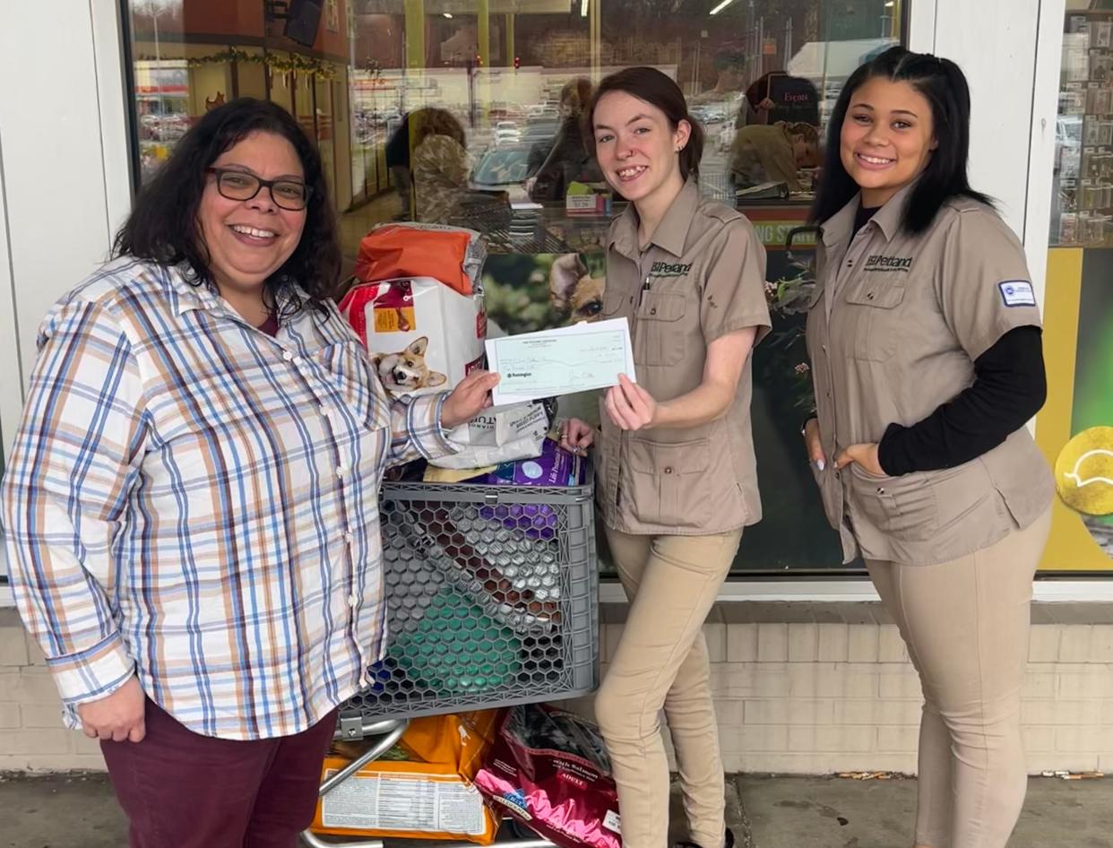 Petland Ashland employees present supplies and $500 from Petland Charities to Catherine Delvalle with Cabin Critters Rescue of Wheelersburg, OH. Courtesy: Petland, Inc.