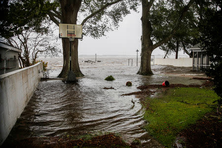 Water from Neuse River starts flooding houses as the Hurricane Florence comes ashore in New Bern, North Carolina, U.S., September 13, 2018. REUTERS/Eduardo Munoz