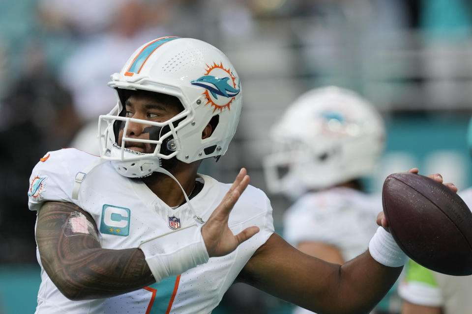 Miami Dolphins quarterback Tua Tagovailoa (1) warms up before an NFL football game against the New York Jets, Sunday, Dec. 17, 2023, in Miami Gardens, Fla. (AP Photo/Rebecca Blackwell)