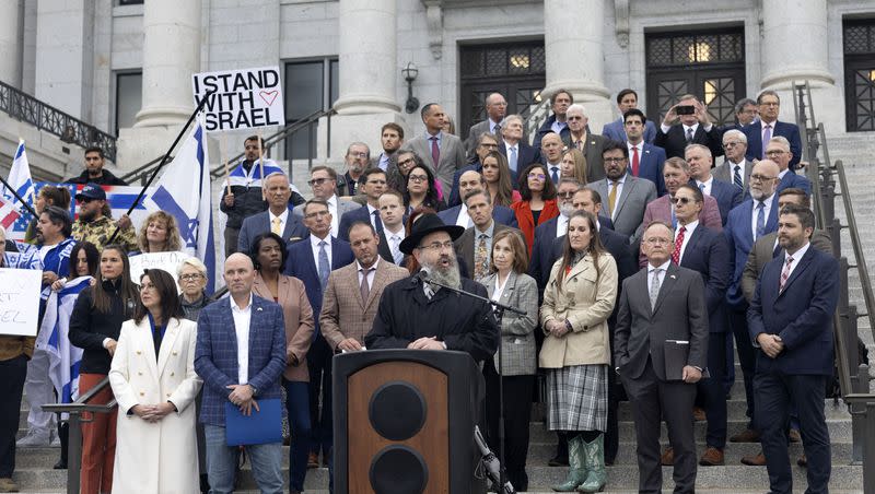 Utah legislators stand with Rabbi Benny Zippel, executive director of Chabad of Utah, as he speaks at the Stand with Israel rally at the Capitol in Salt Lake City on Wednesday, Oct. 11, 2023.