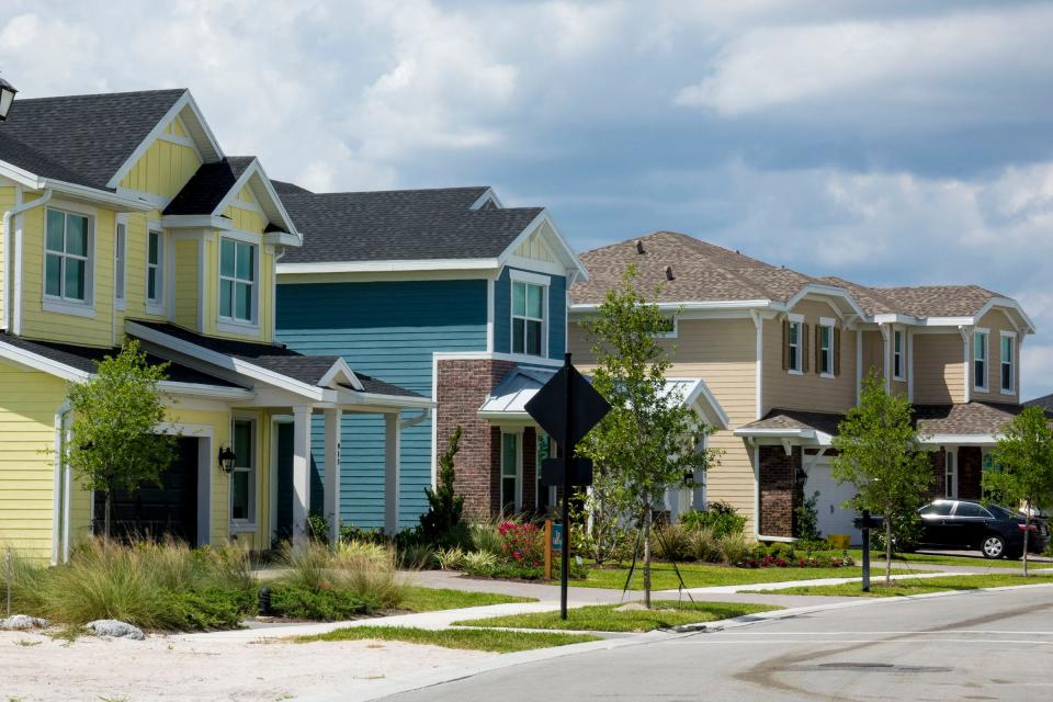 A row of new houses built by Ryan Homes inside the new Arden community in Loxahatchee  on April 2, 2018.  