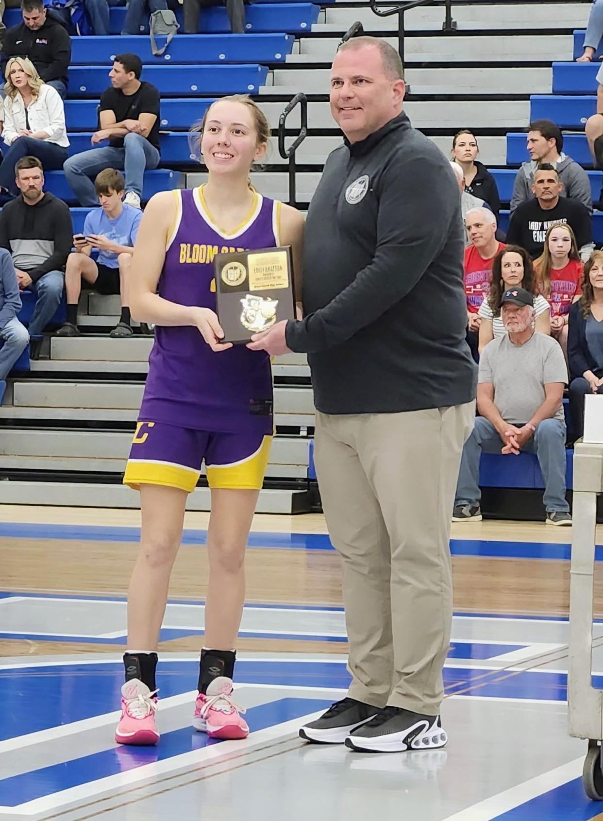 Bloom-Carroll's Emily Bratton is honored as Division II state Player of the Year during halftime of the Ohio High School Basketball Coaches Association North-South game Friday night at Olentangy Liberty. Presenting the award is John Bronczek of HUDL. Bratton, a Miami University signee, led the Bulldogs to a Division II district championship this season.