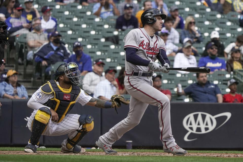 Atlanta Braves' Freddie Freeman hits a grand slam during the seventh inning of a baseball game against the Milwaukee Brewers Sunday, May 16, 2021, in Milwaukee. (AP Photo/Morry Gash)