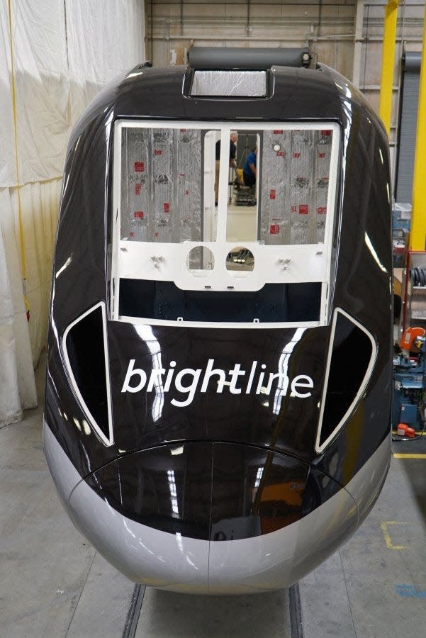 The first Brightline locomotive is unveiled at the Siemens Mobility plant in Sacramento.