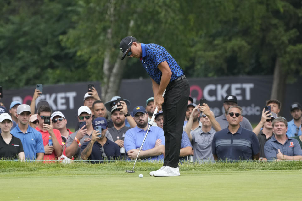 Rickie Fowler putts on the fourth green during the third round of the Rocket Mortgage Classic golf tournament at Detroit Country Club, Saturday, July 1, 2023, in Detroit. (AP Photo/Carlos Osorio)