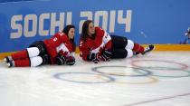 Canada's Melodie Daoust (L) and Lauriane Rougeau from the national ice hockey women's team pose for a picture during a training session at the Shayba Arena in preparation for the 2014 Sochi Winter Olympics, February 6, 2014. The women's ice hockey competition begins on February 8. REUTERS/Grigory Dukor (RUSSIA - Tags: SPORT OLYMPICS ICE HOCKEY)