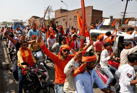 Hindu Yuva Vahini vigilante members take part in a rally in the city of Unnao, India, April 5, 2017. REUTERS/Cathal McNaughton