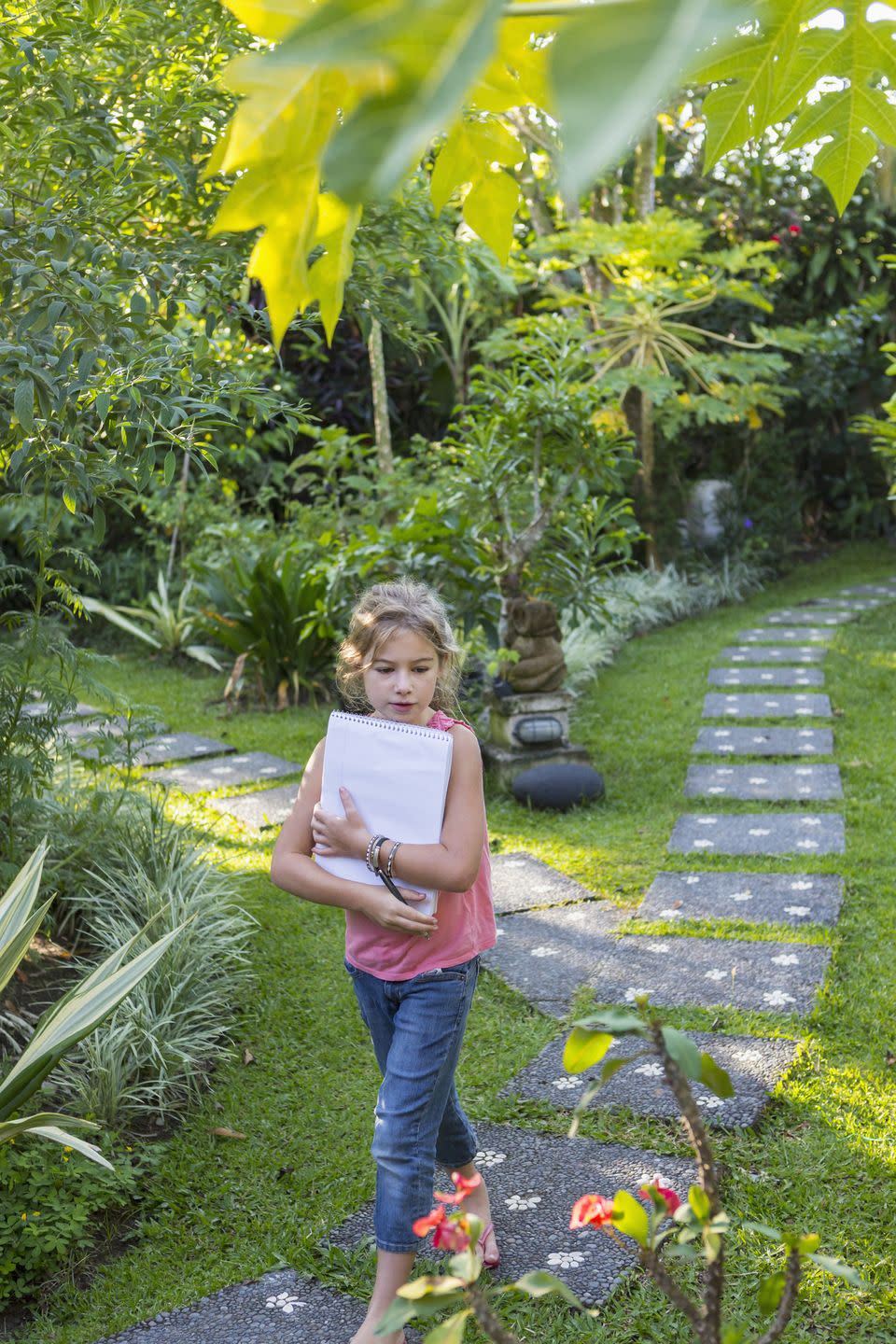 girl with notebook in backyard 4th of july activities