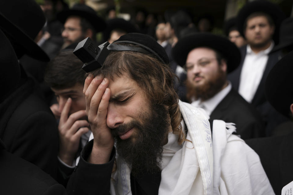 Ultra-Orthodox Jews attend the funeral of Rabbi Chaim Kanievsky in Bnei Brak, Israel Sunday, March 20, 2022. Kanievsky was one of the most influential scholars in the religious community in Israel. He died Friday at the age of 94. (AP Photo/Ariel Schalit)