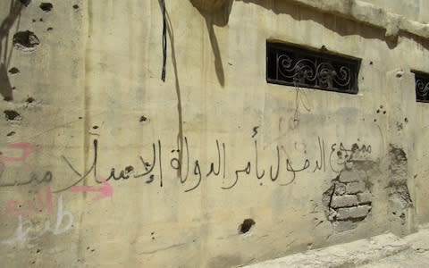 Grafitti on Our Lady cathedral, Mosul, Iraq, reads "Entry forbidden upon the order of the Islamic state" - Credit: Tim Stanley