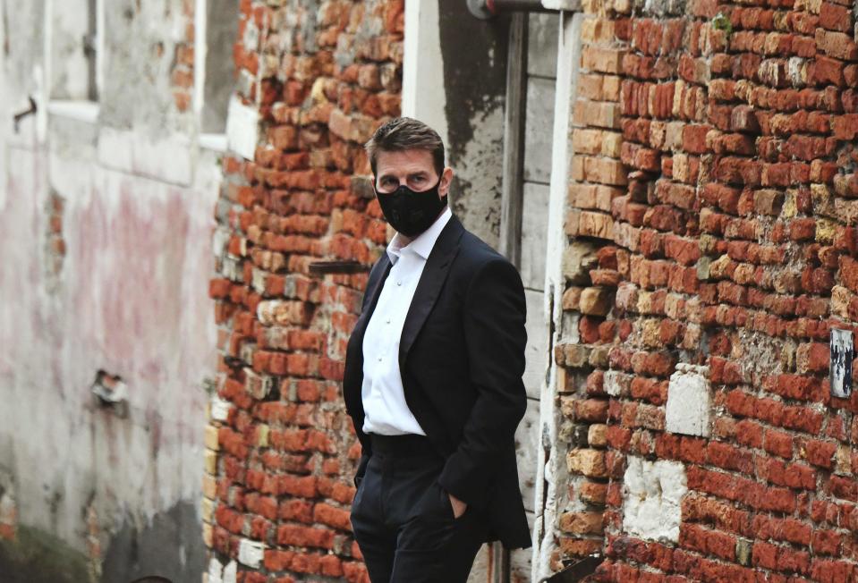 Tom Cruise wears a mask on the set of "Mission: Impossible 7" in Venice.