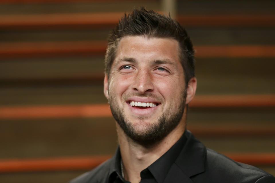 Former NFL player Tim Tebow arrives at the 2014 Vanity Fair Oscars Party in West Hollywood, California March 2, 2014. REUTERS/Danny Moloshok