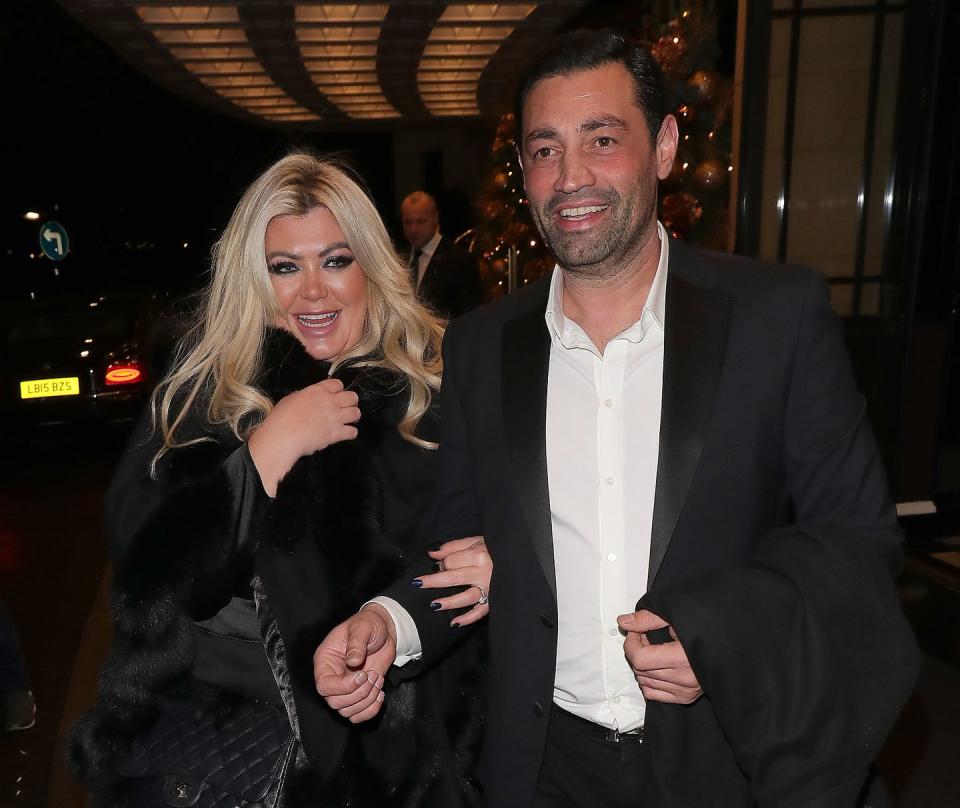 gemma collins and rami hawash, a couple walk arm in arm down a road and smile at the camera