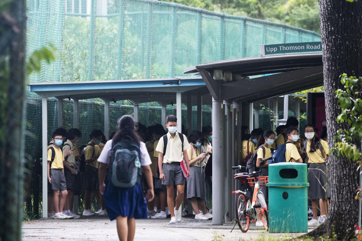 SINGAPORE, June 3, 2020 -- Students crowd into a bus stop as they wait for the public bus in Singapore's central area on June 3, 2020. Singapore enters the second day of post lockdown as the state embarked on a phased reopening from a COVID-19 