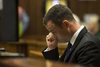 Oscar Pistorius, sits in the dock at a court in Pretoria, South Africa, Monday, March 17, 2014. Pistorius is on trial for the murder of his girlfriend Reeva Steenkamp on Valentines Day, 2013. (AP Photo/Daniel Born, Pool)