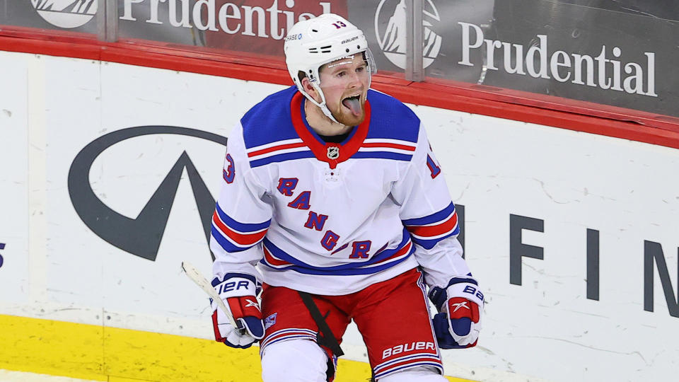 NEWARK, NJ - MARCH 04:  New York Rangers left wing Alexis Lafreniere (13) celebrates the goal by New York Rangers right wing Pavel Buchnevich (89)(not pictured) and gets an assist during the third period of the National Hockey League game between the New Jersey Devils and the New York Rangers on March 4, 2021 at the Prudential Center in Newark, NJ.  (Photo by Rich Graessle/Icon Sportswire via Getty Images)