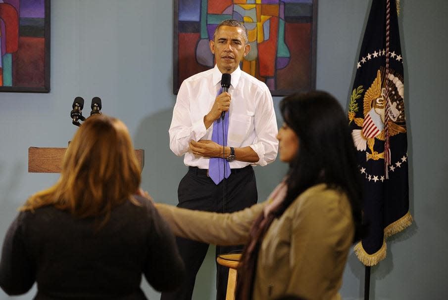 President Barack Obama takes questions during a visit to Casa Azafran to address immigration issues.