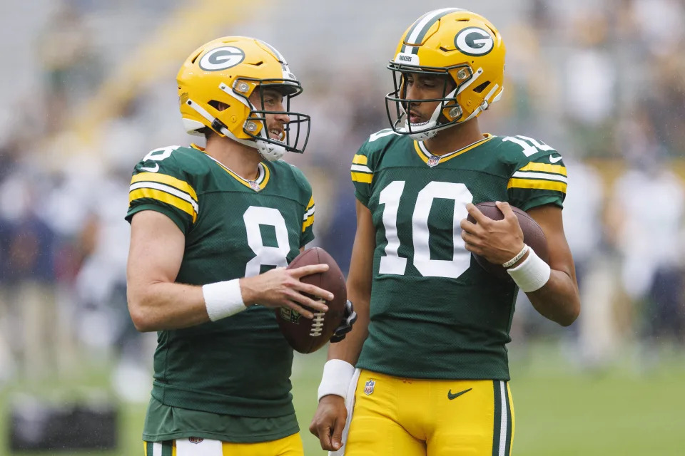 Aug 26, 2023; Green Bay, Wisconsin, USA; Green Bay Packers quarterbacks Sean Clifford (8) a dn <a class="link " href="https://sports.yahoo.com/nfl/players/32696" data-i13n="sec:content-canvas;subsec:anchor_text;elm:context_link" data-ylk="slk:Jordan Love;sec:content-canvas;subsec:anchor_text;elm:context_link;itc:0"&gtJordan Love</a> (10) talk on the field during warmups prior to the game against the <a class="link " href="https://sports.yahoo.com/nfl/teams/seattle/" data-i13n="sec:content-canvas;subsec:anchor_text;elm:context_link" data-ylk="slk:Seattle Seahawks;sec:content-canvas;subsec:anchor_text;elm:context_link;itc:0"&gtSeattle Seahawks</a> at Lambeau Field. Mandatory Credit: Jeff Hanisch-USA TODAY Sports